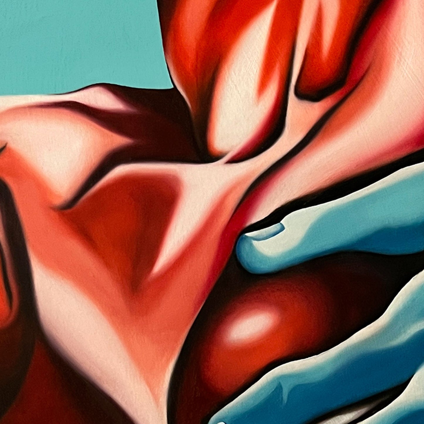Close up of original artwork featuring a mint blue hand holding deep red cherry-like breasts.