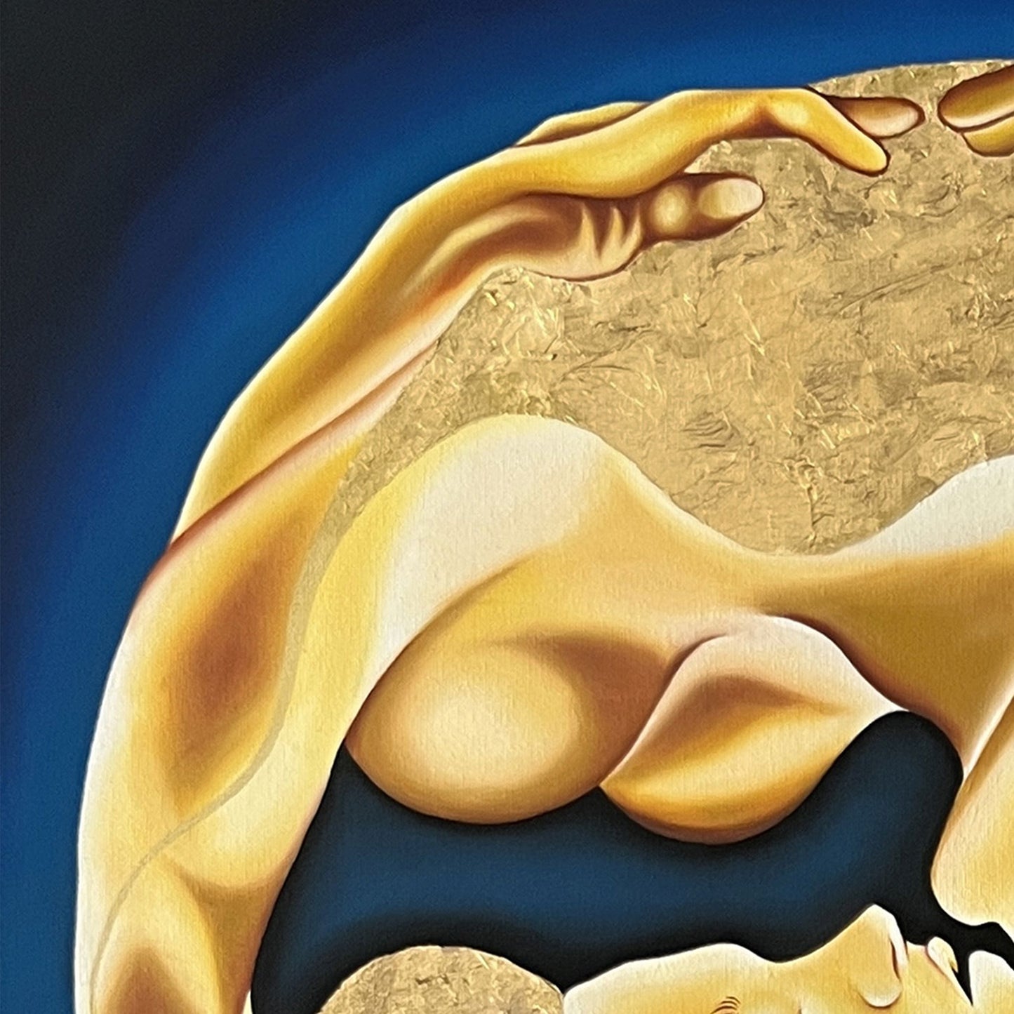 Close up of painting with a gold circular design featuring two figures embracing on a blue background