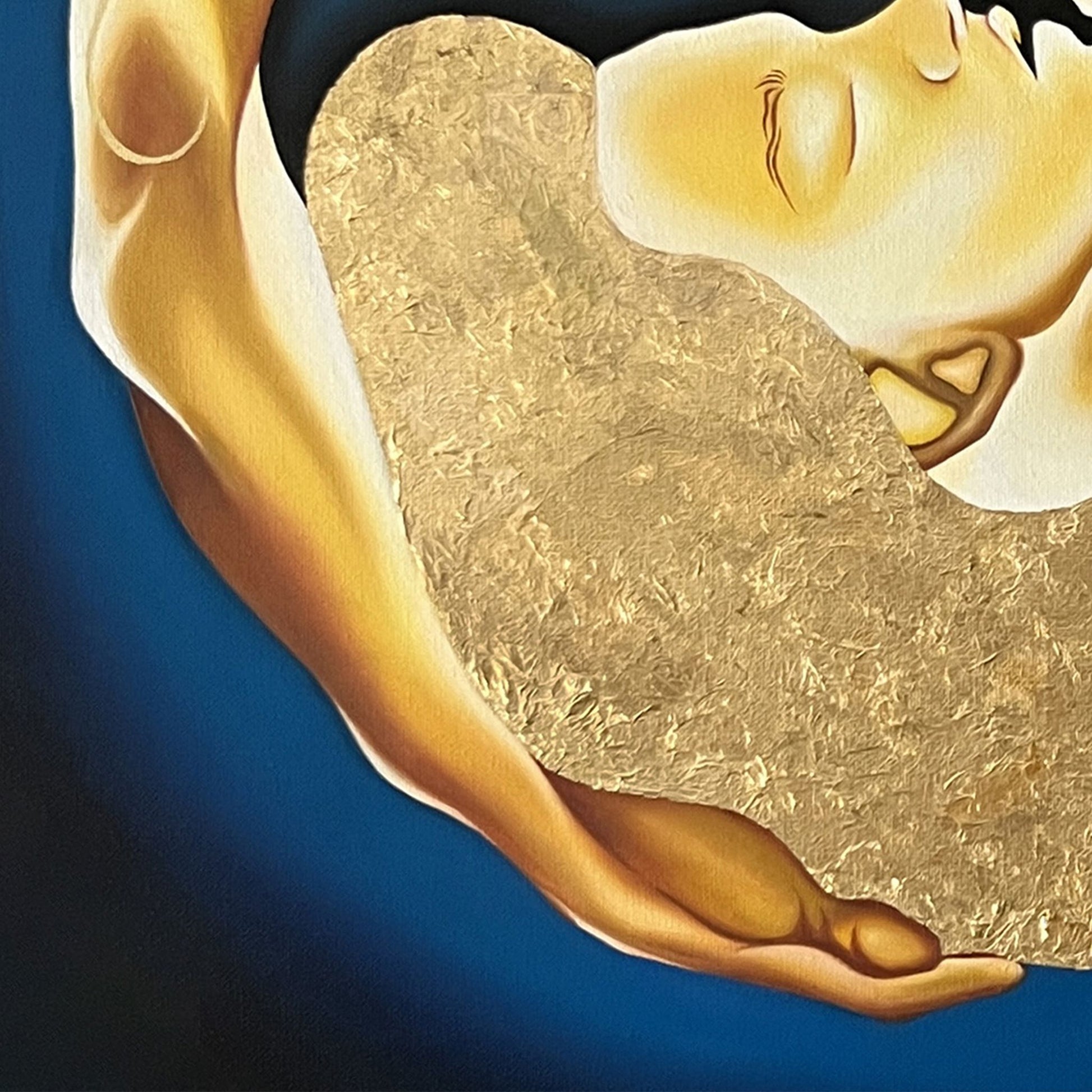 Close up of painting with a gold circular design featuring two figures embracing on a blue background