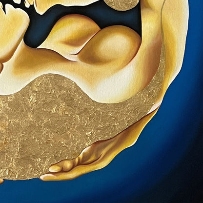 Close up of painting with a gold circular design featuring two figures embracing on a blue background