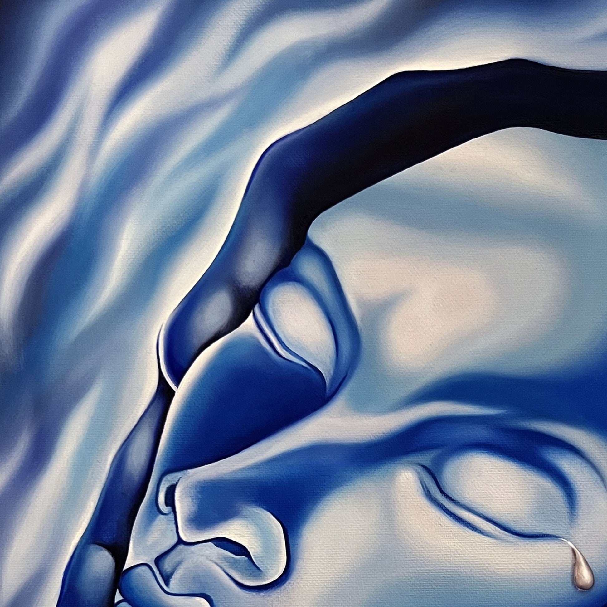 Close up of an original artistic depiction of hands holding a face with surrounding blue tones.