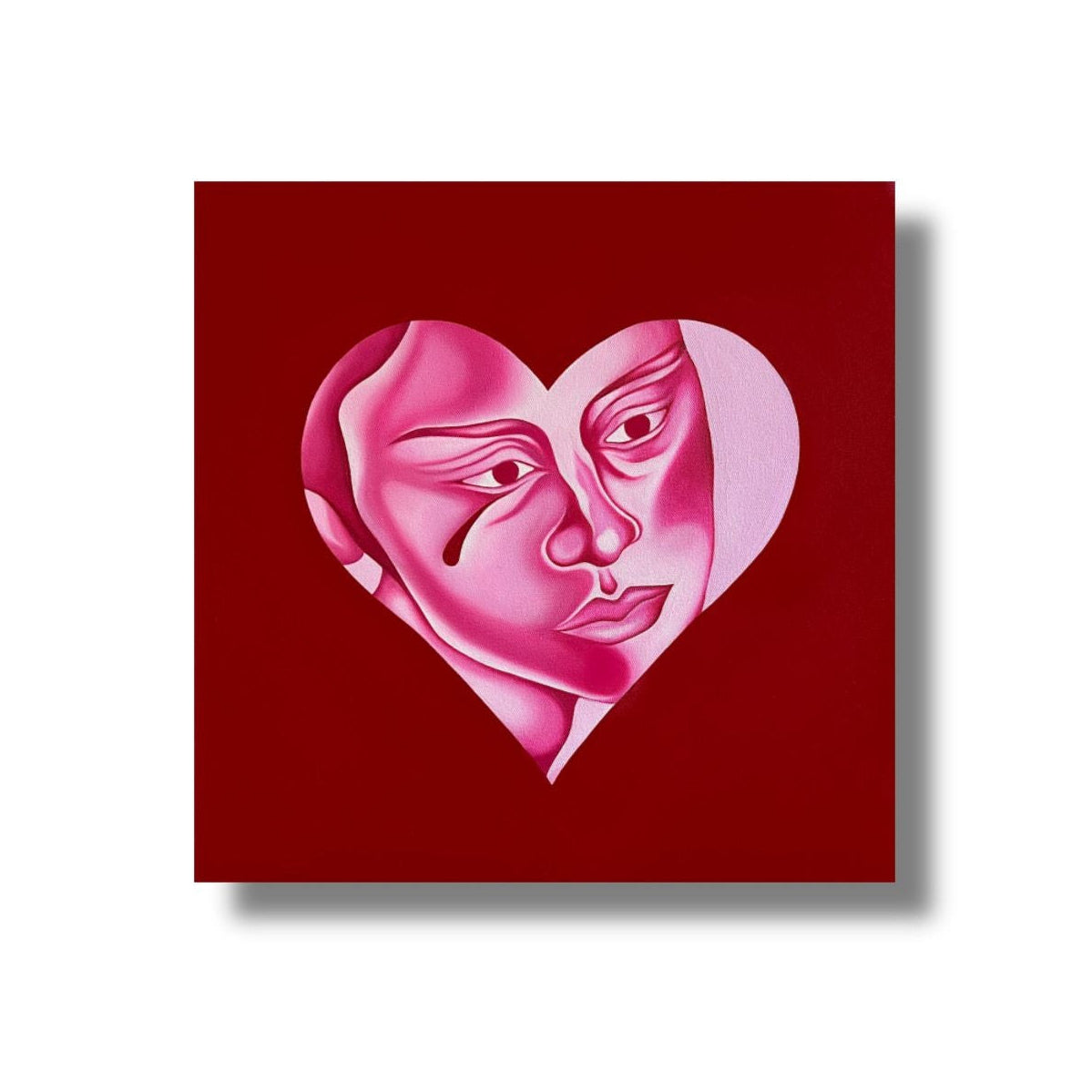 Heart-shaped artwork with a face on a red background