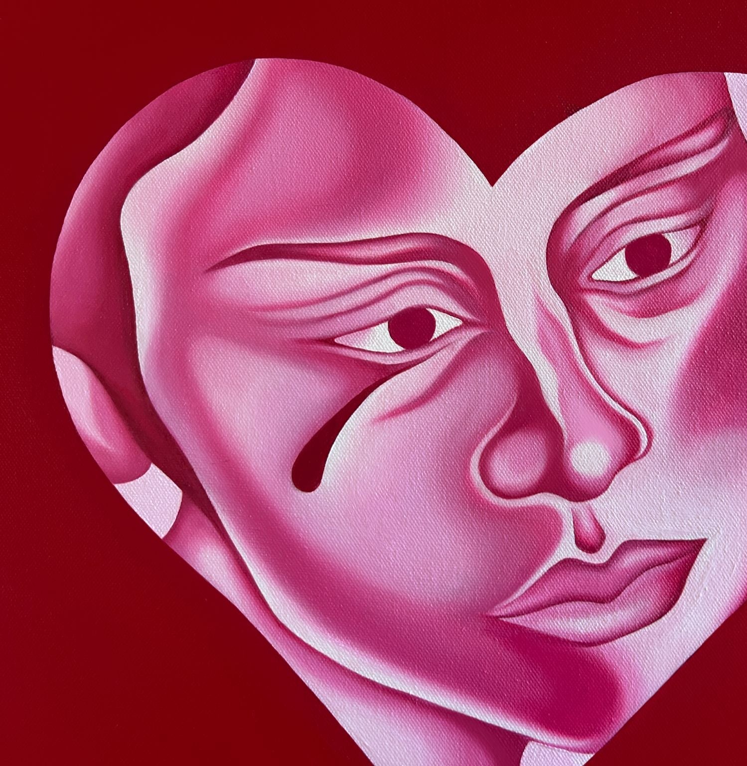 Artistic depiction of a heart with two faces inside on a red background